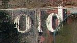 A photograph of the word 'Old' on a wall